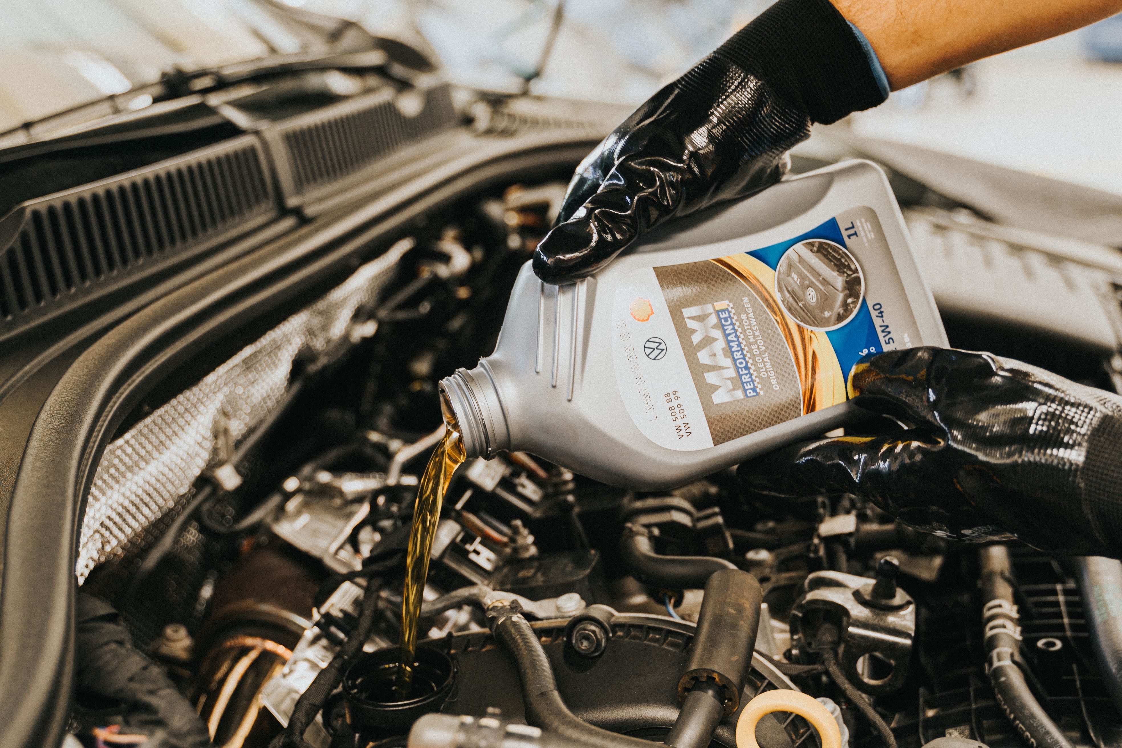 Inspecting an engine bay for oil leaks and valve cover leaks