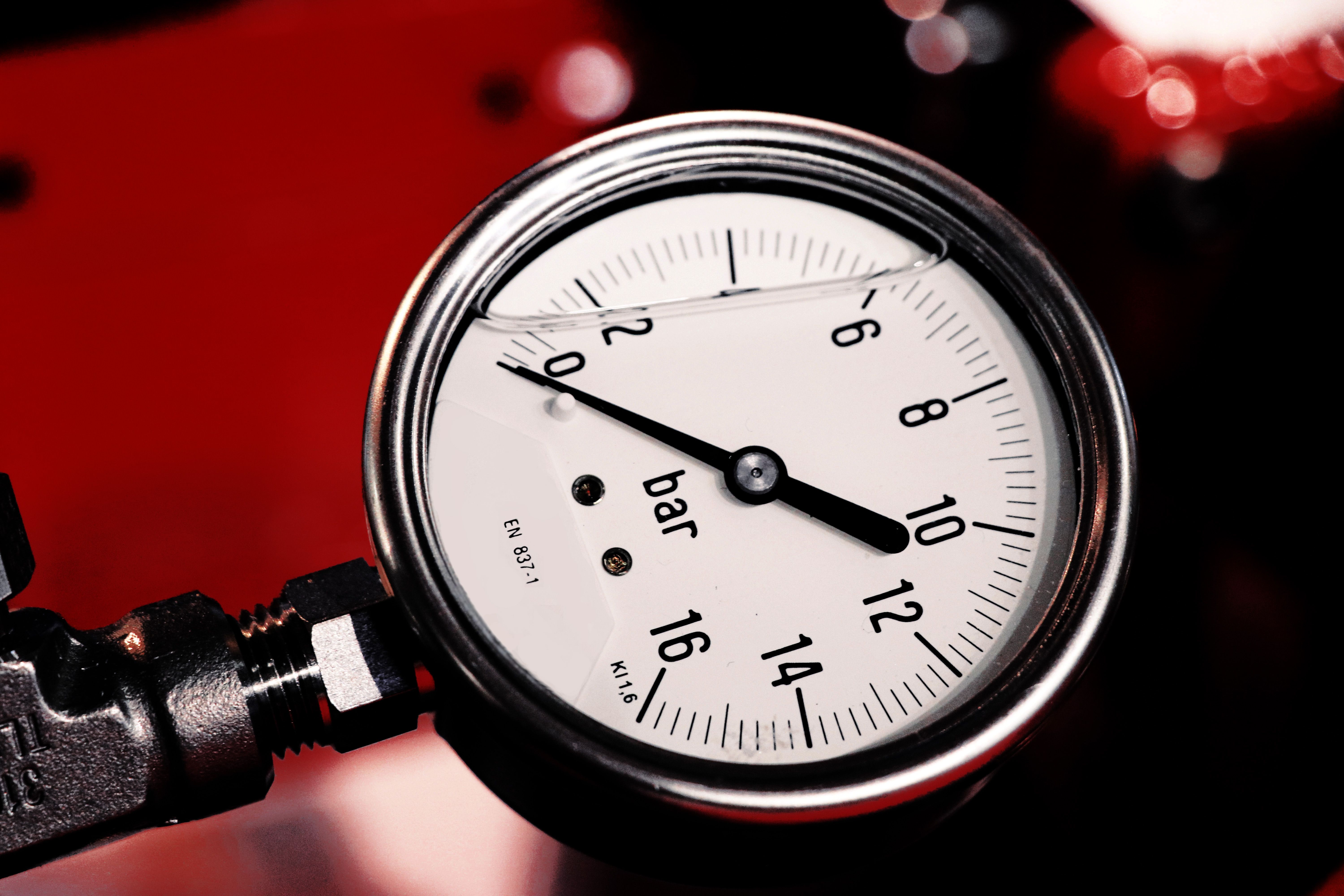 Red engine oil pressure warning symbol illuminated on a car dashboard