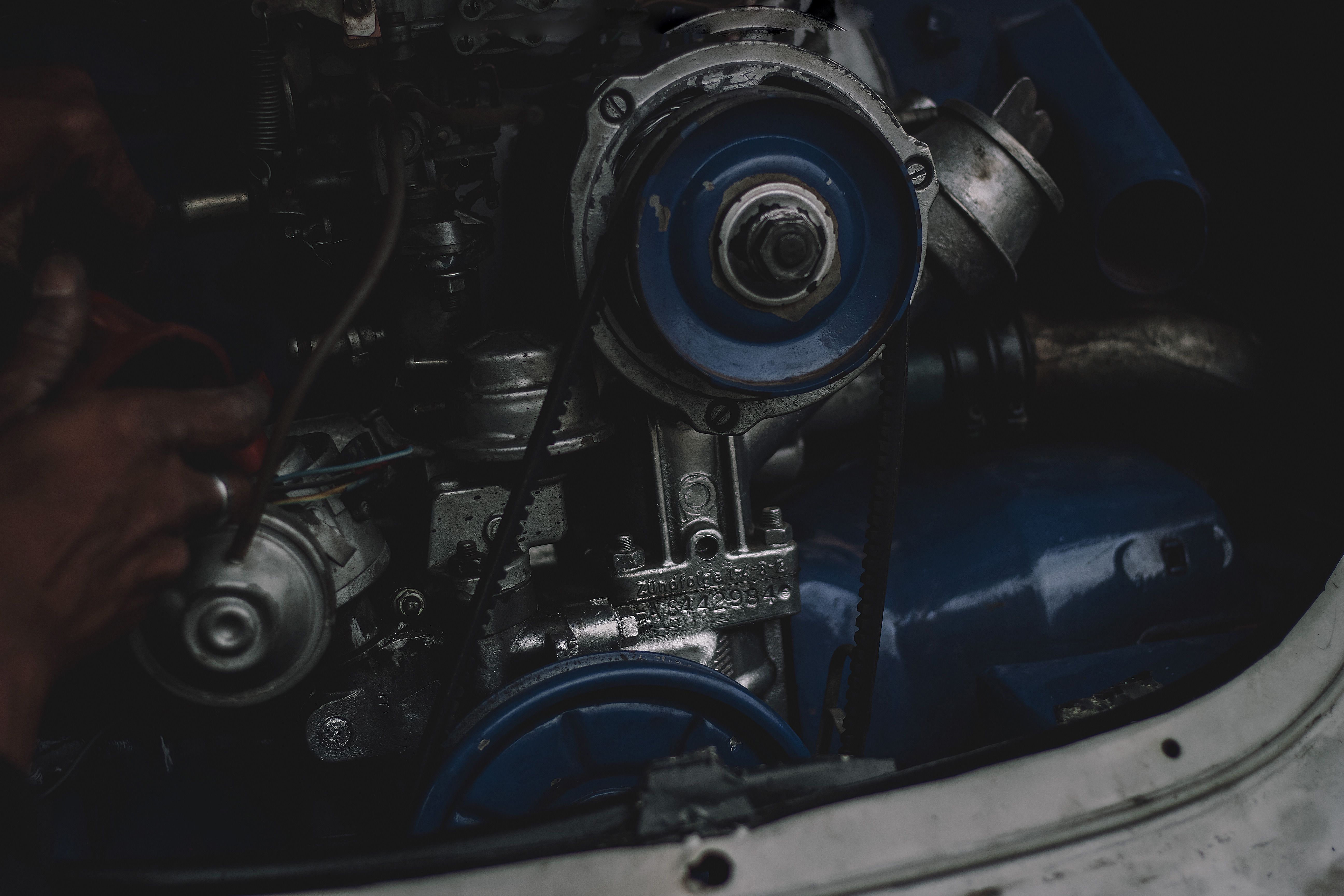 Car alternator installed in an engine bay